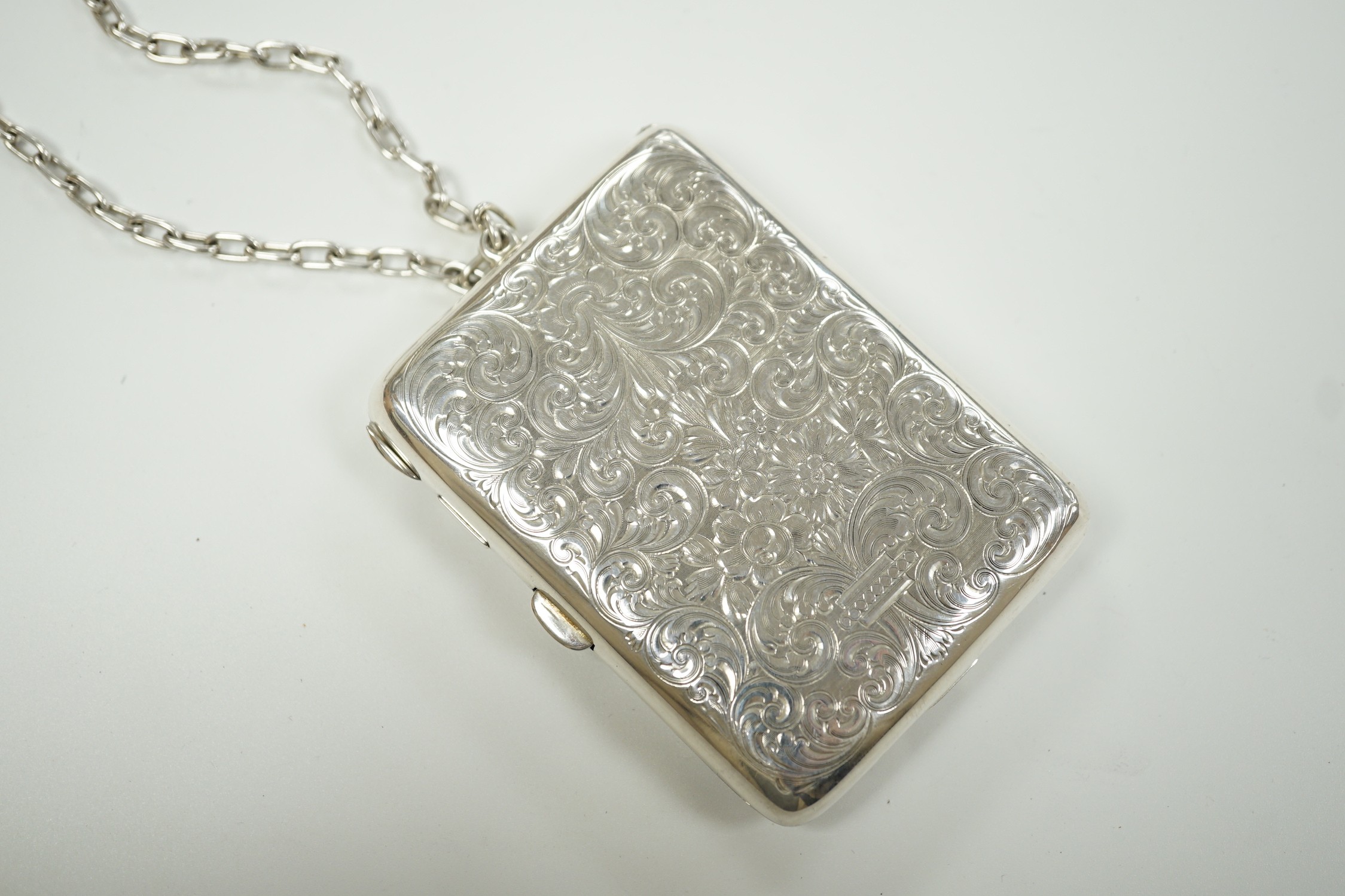An early 20th century American engraved sterling rounded rectangular combination aide memoir, purse, pill box, sovereign and half sovereign case, by R. Blackinton & Co, with pencil and suspension chain, 88mm.